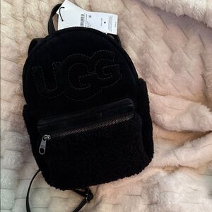 UGG Black Shearling Women's Backpack with duster.